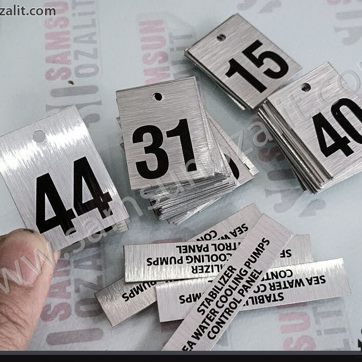 metal label printing, perforated product with sequence number printed on it, binding can be done through the holes, can also be used as a tree number, metal label production with printed holes